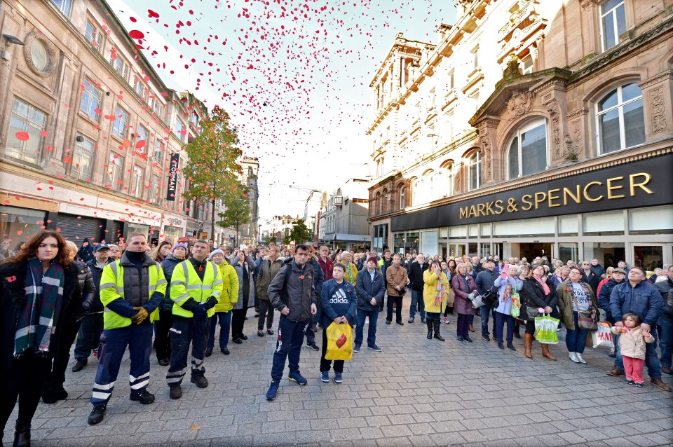  Liverpool observes two-minute silence as poppies fall from above