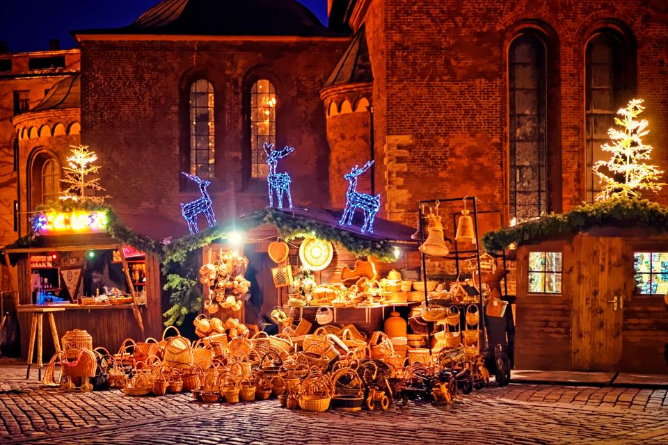  A European Christmas market square in the evening in Riga, Latvia, which offers the second cheapest accommodation costs