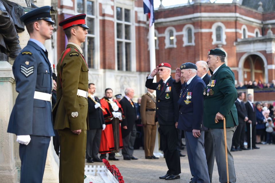  Veterans salute at the cenotaph in Croydon