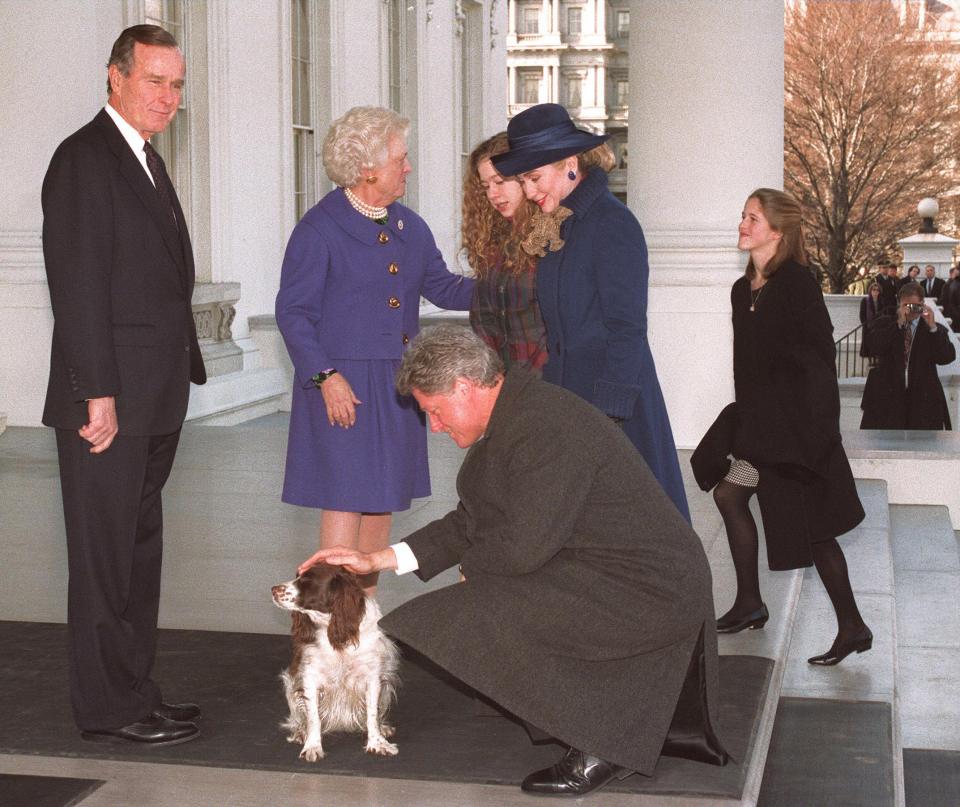  Traditional welcome photo-op saw the Clintons pictured in a tender moment as they were welcomed to the White House after Bill's 1992 victory