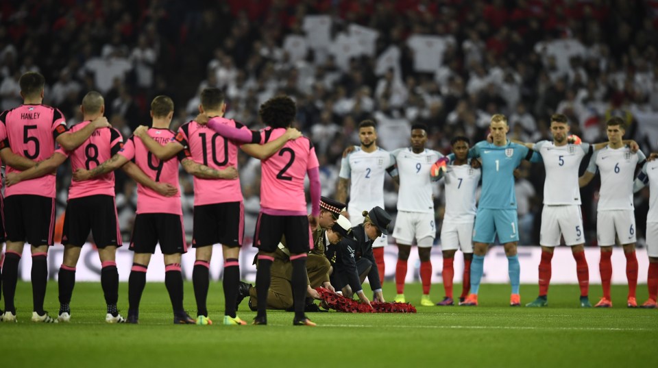 The two sides line up for a minute silence before kick-off