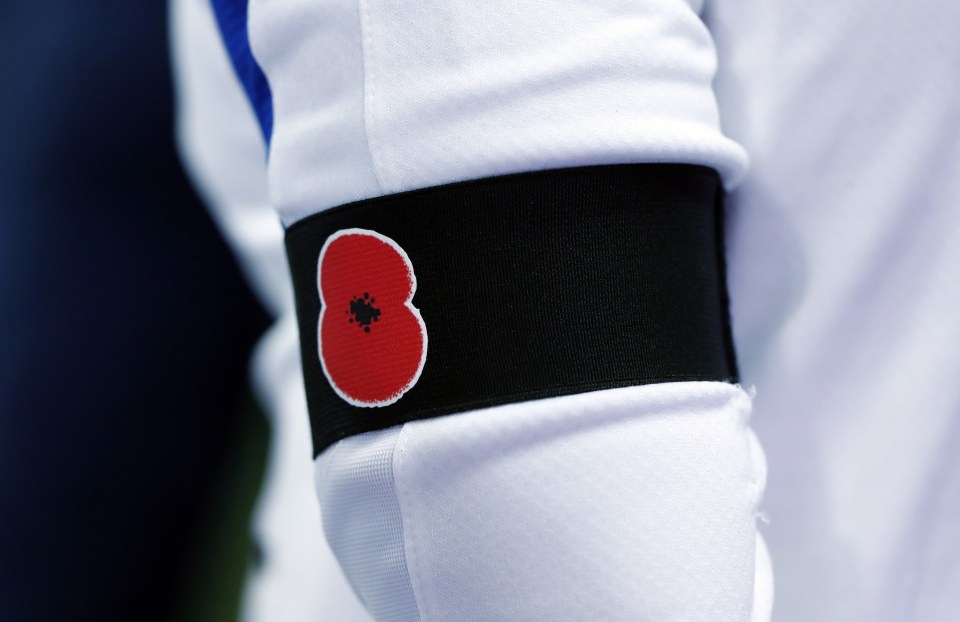 Both sides wore poppies on black armbands, risking potential FIFA action