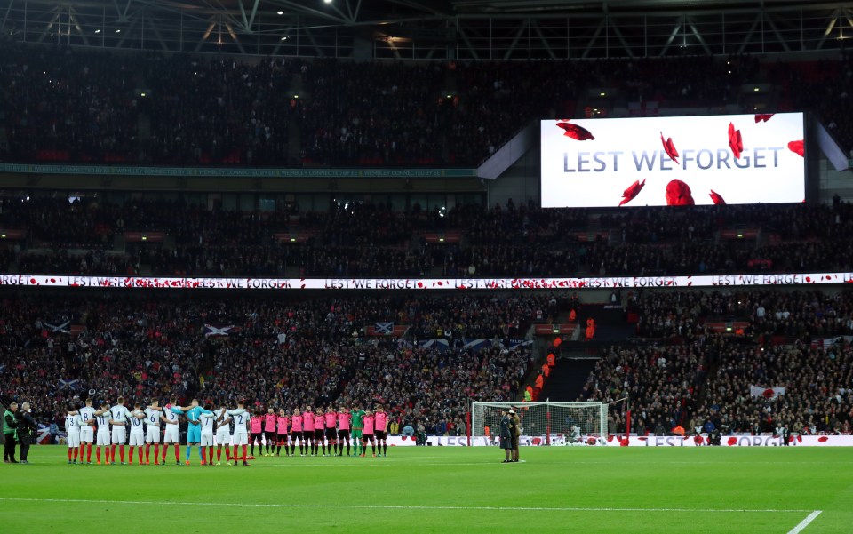 The big screen is lit up with the message 'Lest We Forget' during the period of silence