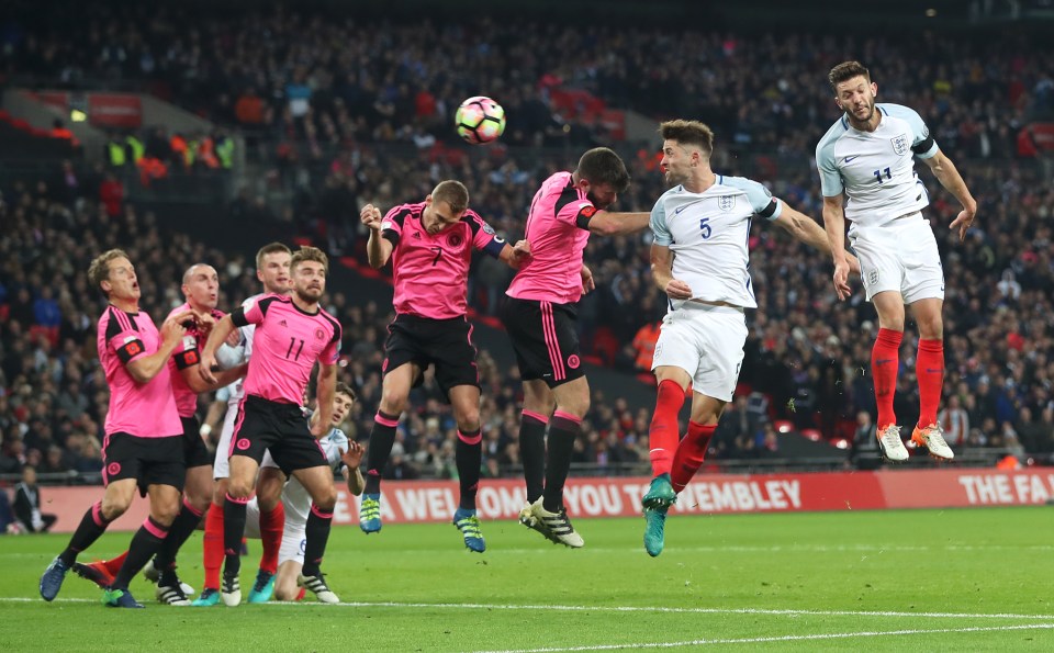 Gary Cahill jumps to meet Wayne Rooney's whipped corner kick