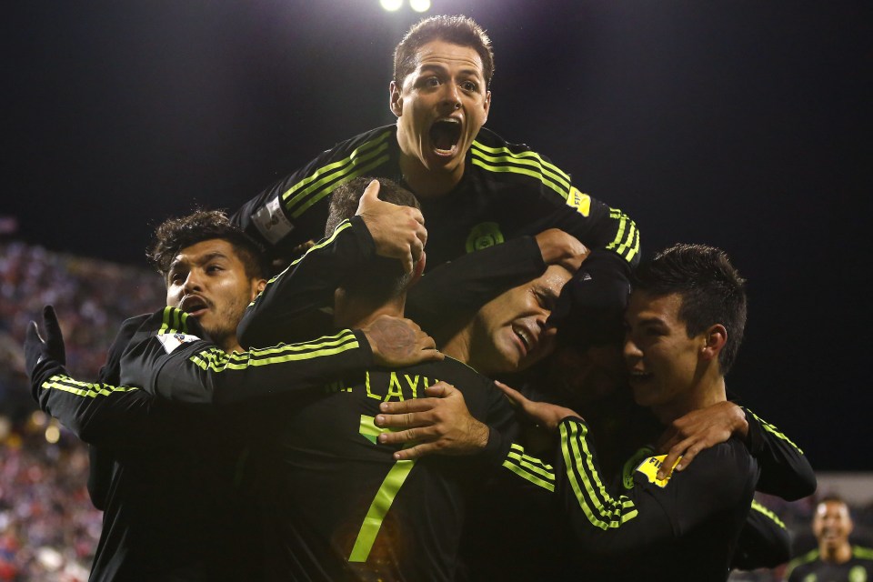  Javier Hernandez and his Mexico team-mates mob Marquez after the skipper netted the winner