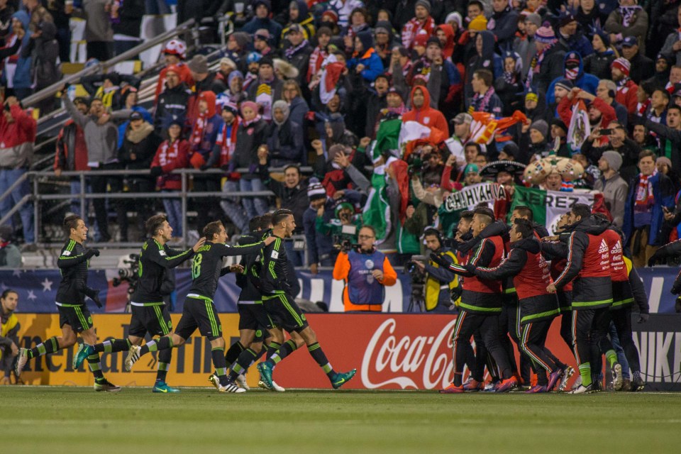  The Mexico players sprint to celebrate with their bench in celebration