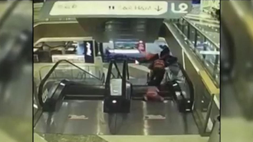  There's heartbreaking scenes as the mum rushes down the escalator