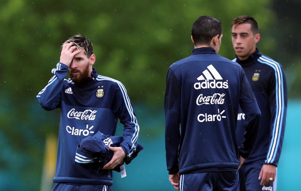 Messi gestures to team-mates Angel Di Maria and Ramiro Funes Mori