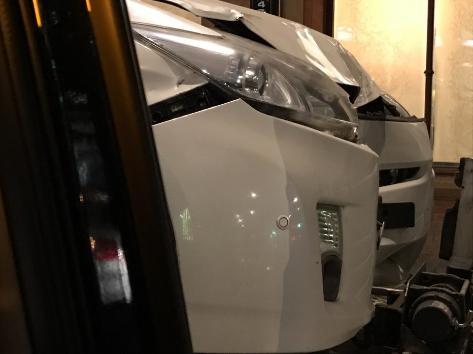  The white Toyota Prius was severely damaged