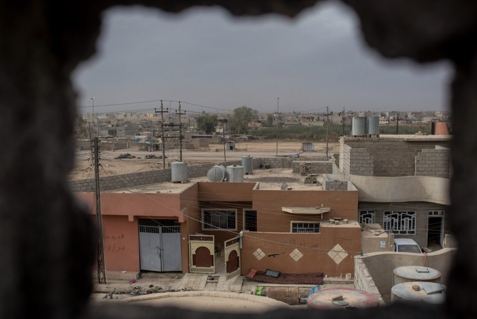  A prized 'sniper hole' at a home in the Entisar district of Mosul