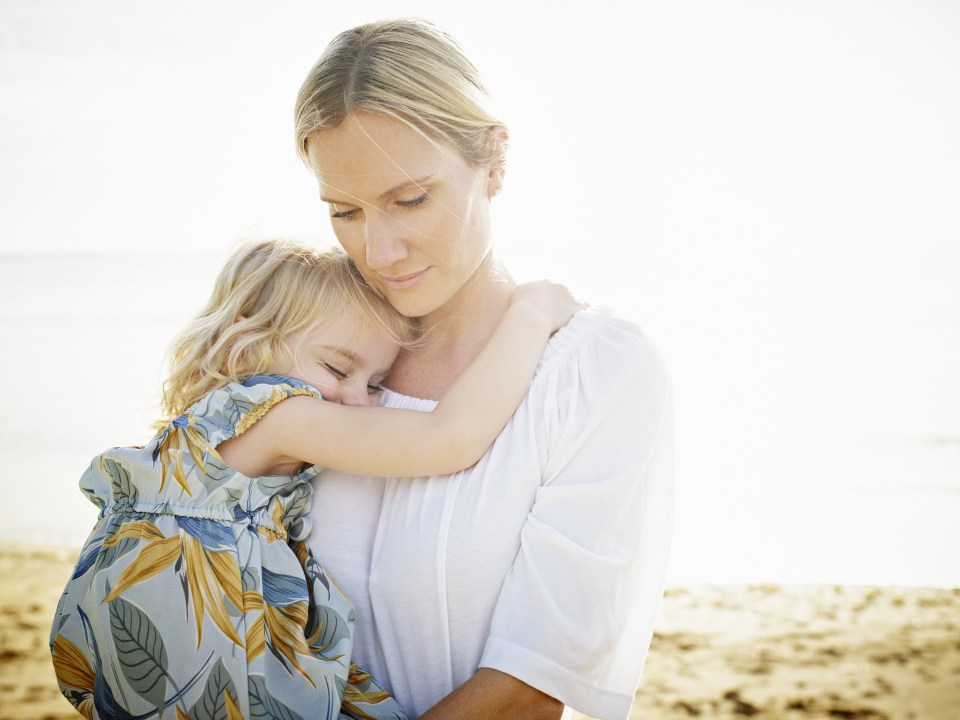 Mother holding daughter 