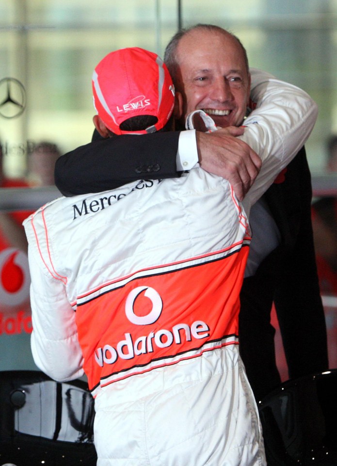  Dennis and Hamilton share a hug after he won the 2008 world championship