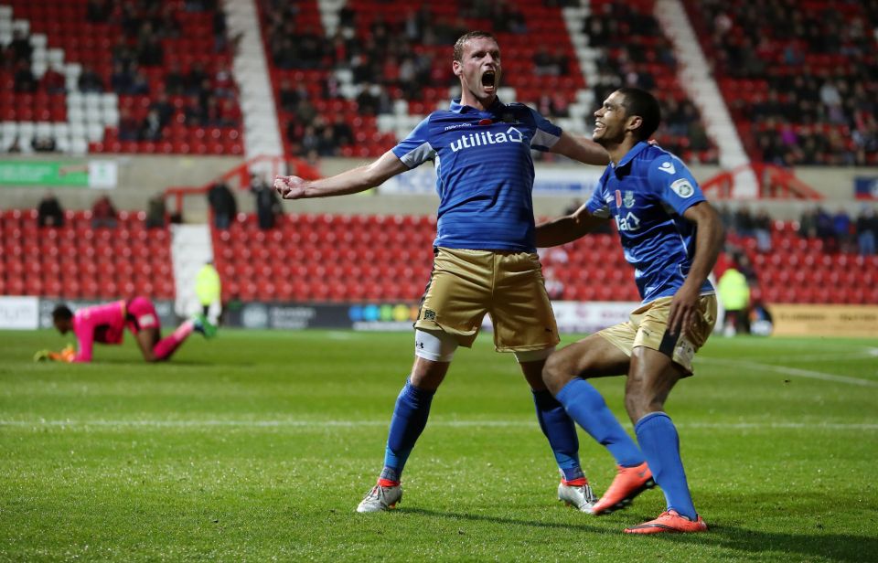 Andy Drury celebrates after putting Eastleigh into a 2-0 half-time lead with a sublime chip