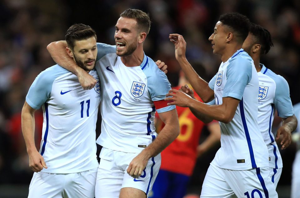 Adam Lallana celebrates his penalty opener in the friendly against Spain last week after thriving under the management of Southgate 