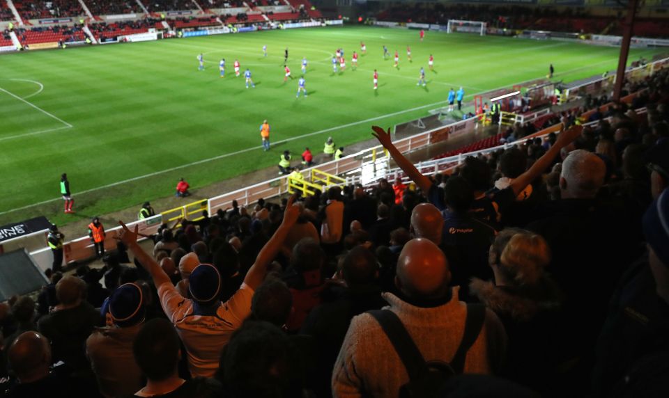 The Eastleigh fans celebrate as they realise they are on their way into the second round