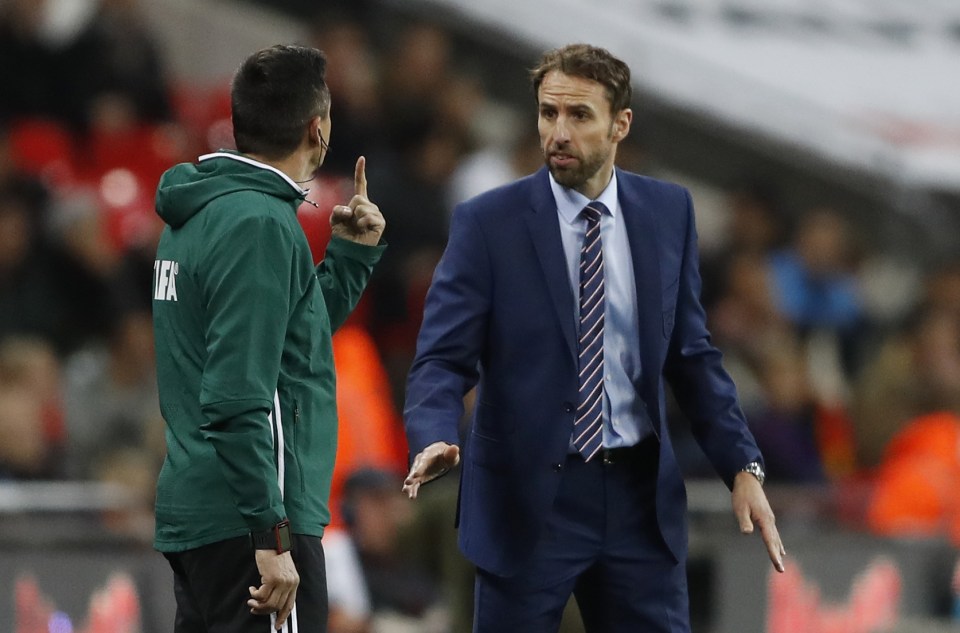 England interim manager Gareth Southgate with the fourth official after Spain's second goal