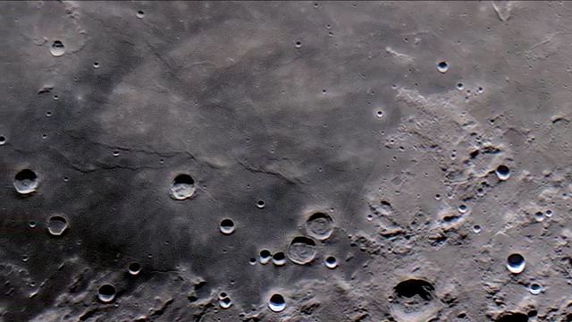  Telescope carefully pans across the moon's dusty surface