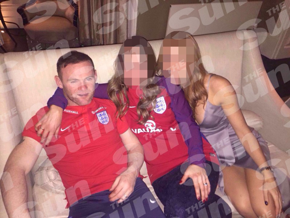 Roo was pictured with two women draped over him, one in his England top