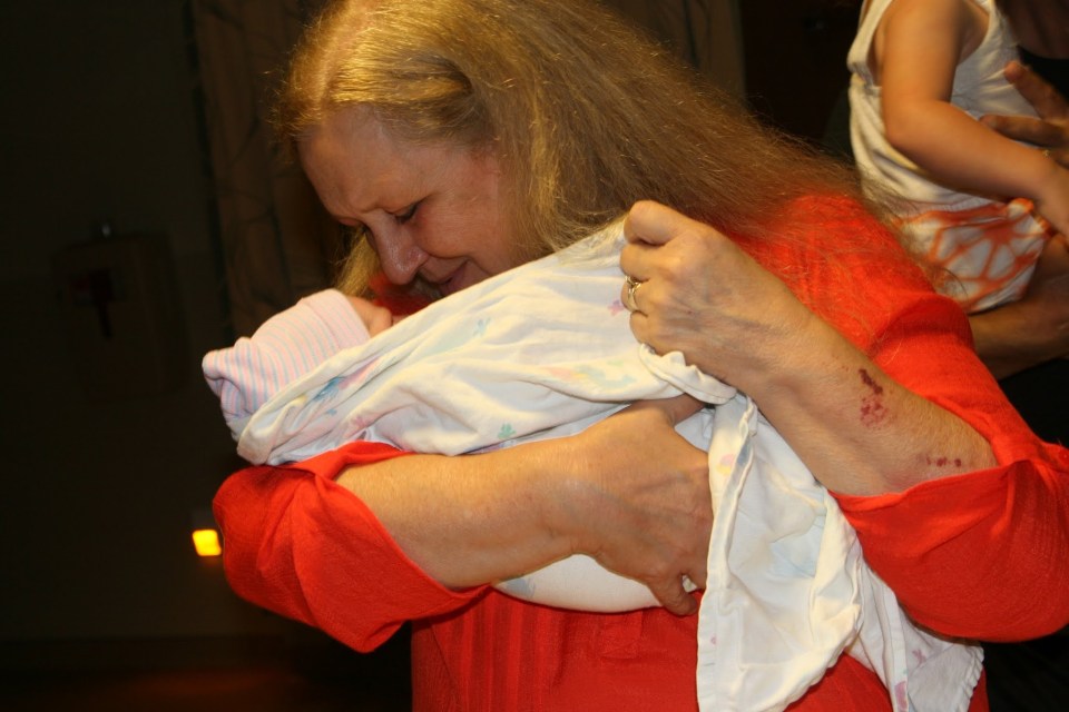 Grandmother Renee, meeting baby Sawyer for the first time, June 2016 