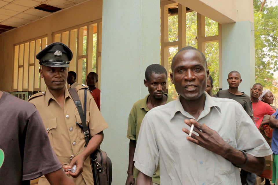  Eric Aniva (right), arrives to the Magistrates Court on August 15, 2016 in Nsanje