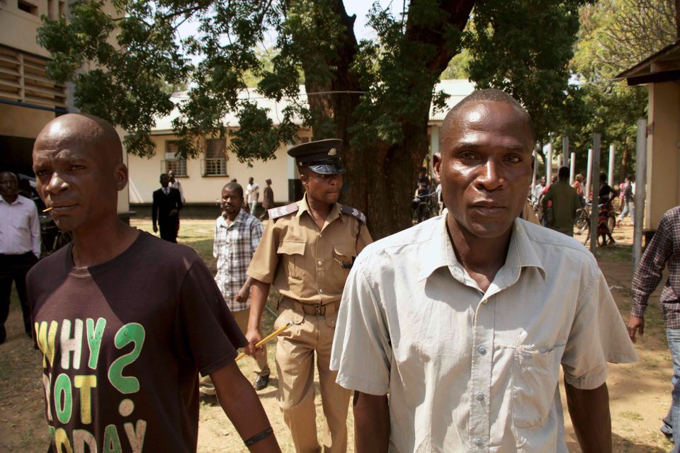  Eric Aniva (right), outside the Magistrates Court on August 15, 2016 in Nsanje