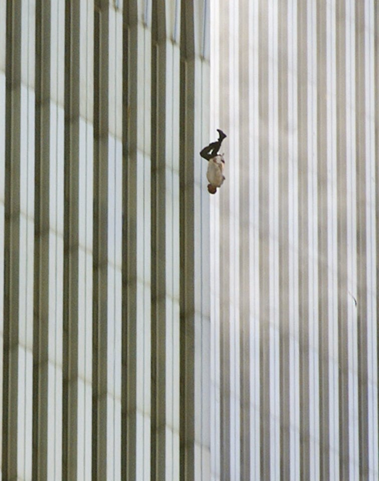 This poignant photo was snapped in the moments after the 9/11 attacks