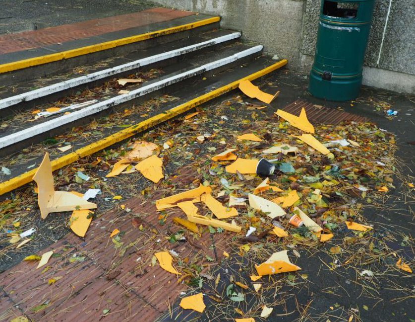  Locals took photos of the scene, including the mess strewn across the ground