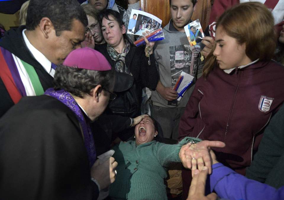  Bishop Acuna performs the often-distressing rituals in front of onlookers