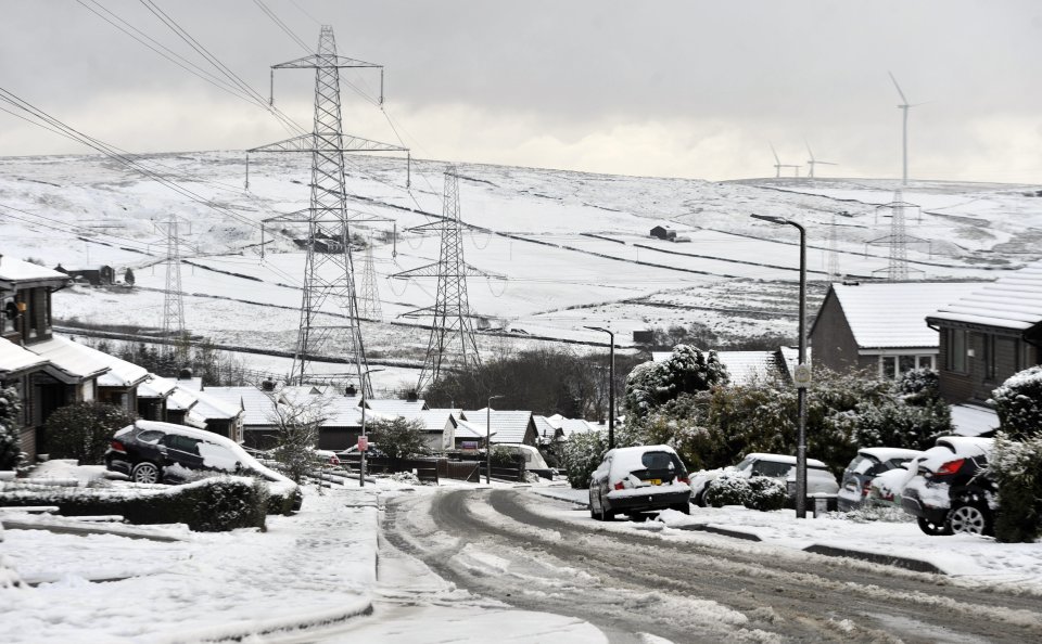  Heavy snowfall causes difficult driving condition for motorists in Bacup, Lancs., as the town is covered in snow