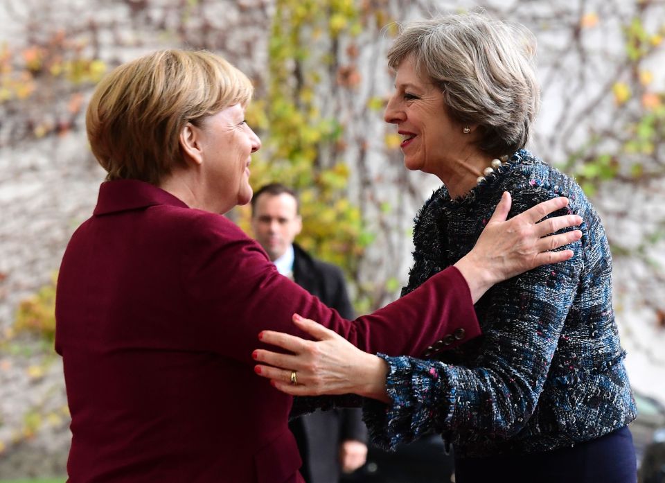  Theresa May and Angela Merkel look positive as the PM arrives in Berlin for talks