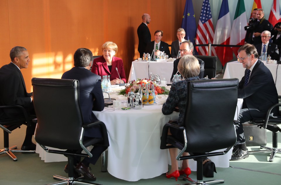  Theresa May sits opposite Angela Merkel but the German Chancellor is flanked by President Obama and French President, Francois Hollande