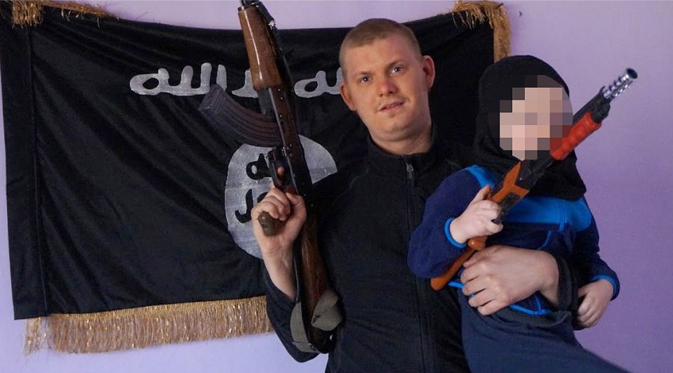  Clutching a rifle and holding his child, Michael Skråmo has been appearing in propaganda videos