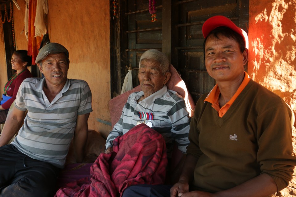 Karna Bahadur Gurung with his sons Sher, right, and Lok, left, said indoor house fires affect thousands in Nepal