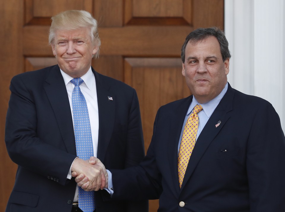  President-elect Donald Trump, left, and New Jersey Gov. Chris Christie shake hands at the Trump National Golf Club