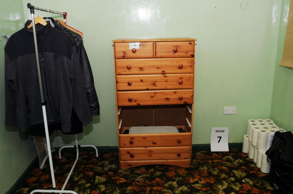  Inside one of the 'sparsely furnished' rooms in Mair's home, containing a chest of drawers, a clothing rail and toilet roll