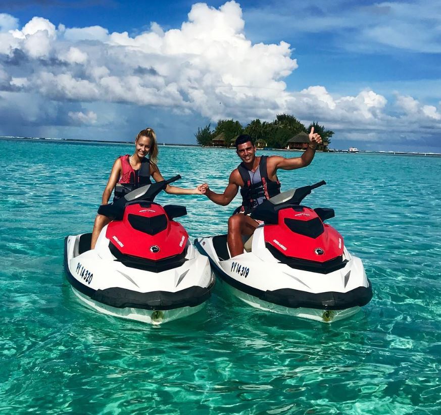 Graziano Pelle and girlfriend Viktoria Varga ride jet skis on their latest holiday