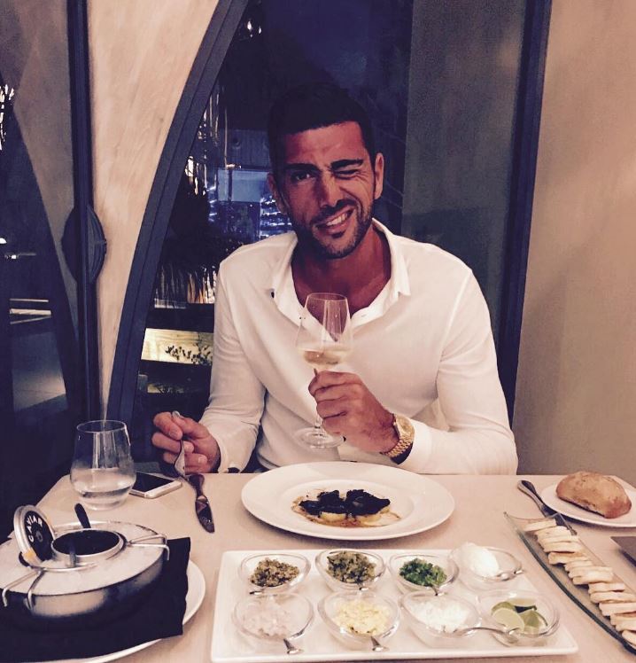 Graziano Pelle looked dapper in a white shirt and gold watch at dinner