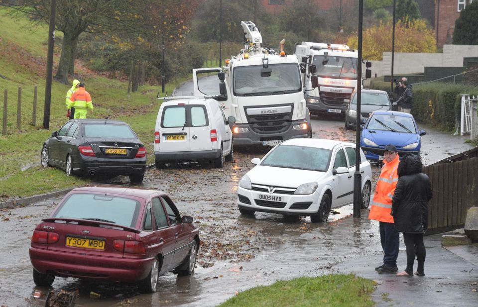 subsided in Whitchurch Lane, Bristol, after a dozen cars were submerged yesterday