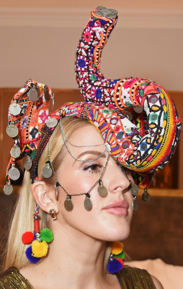 Singer Ellie tried on a jewelled elephant mask for size