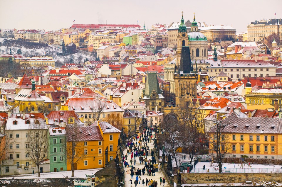 Czech Republic, View of Prague with Charles Bridge in snow