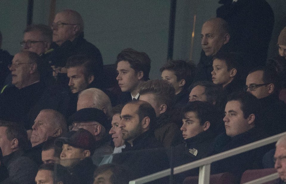 David Beckham watches his former side PSG from the stands at the Emirates