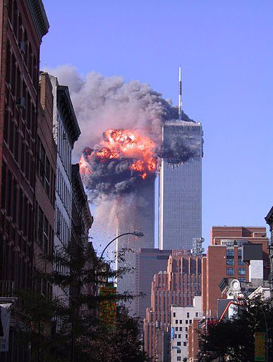  Burning debris from the Twin Towers set fire to Tower 7, seen just in front of the doomed skyscrapers, on multiple floors