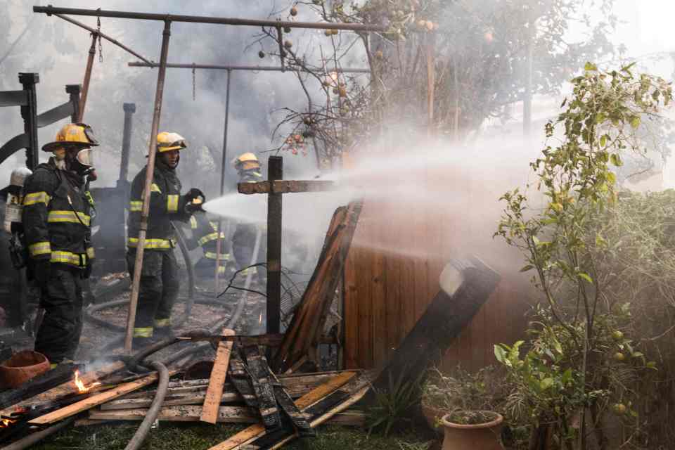  Israeli firefighters help extinguish a fire ... the blaze is the worst in a series of fires to have hit the country in the past few days