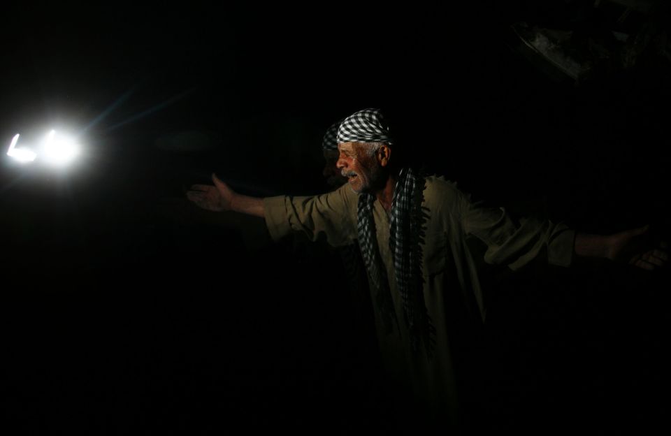  Heartbreak... A man reacts as he talks to the media at the scene of a suicide bombing