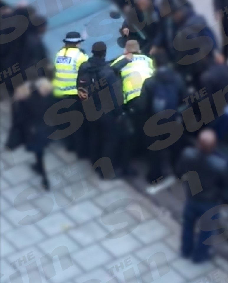  Flashpoint... cops pin suspect on car bonnet. Schoolchildren gather round before trying to wrestle him free