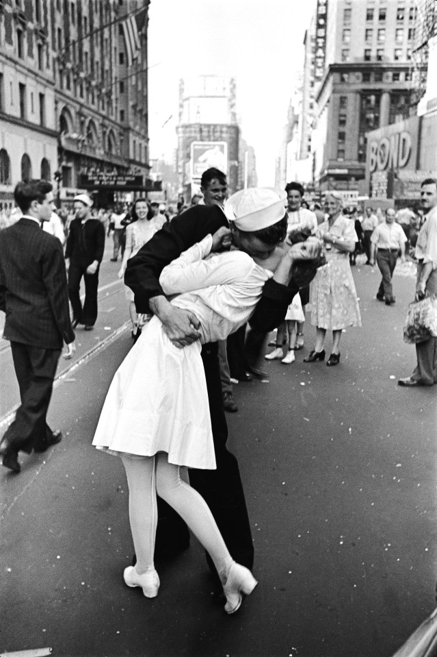 An American sailor passionately kisses a white-uniformed nurse in Times Square to celebrate the long awaited-victory over Japan