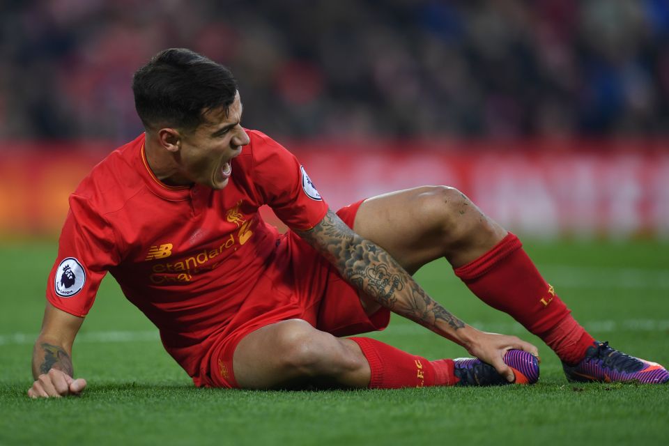  Philippe Coutinho screams in pain after suffering a nasty ankle injury