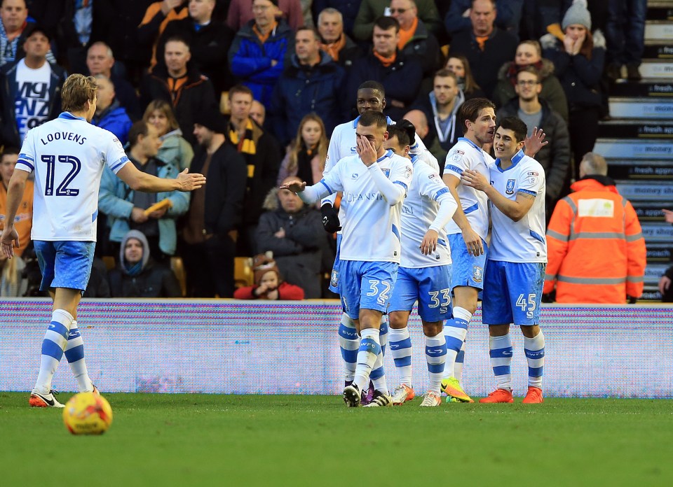 The Owls players celebrate the goal