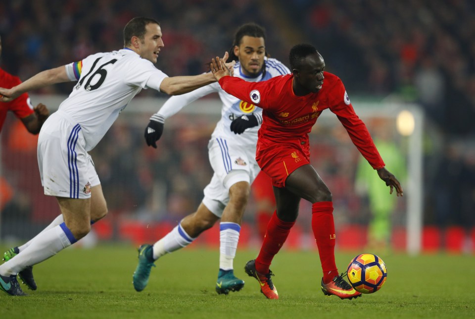  Sadio Mane attempts to escape the clutches of John O'Shea as Sunderland try to hold out against Liverpool