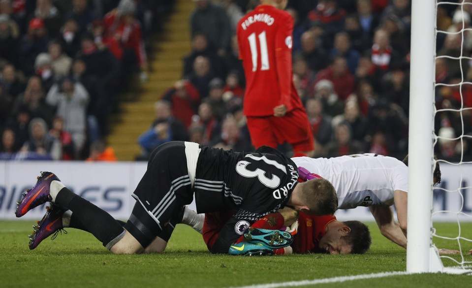  James Milner just misses getting on the end of a cross as he lands in a heap under Sunderland keeper Jordan Pickford